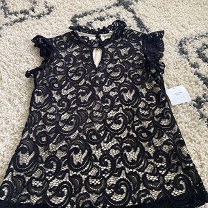 Lace cream and black blouse